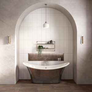 Minimalist residential bathroom featuring a white freestanding bathtub against a wall of American Olean 8x24 white tiles with a built-in mosaic accent niche.