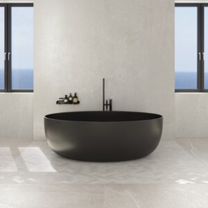 Luxurious modern bathroom featuring expansive, large-format 120x280cm porcelain wall panels in the soft, nature-inspired Linfa finish from the Ibla collection.