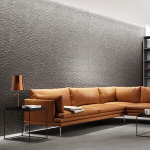 Contemporary living room showcasing seamless porcelain floor tile in the semi-polished Grigio gray colorway from the More collection.