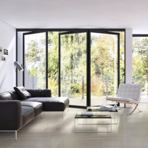 Warm and inviting living room interior featuring durable 12x24-inch porcelain floor tiles in the natural Classic Tan finish from the Matrix collection.