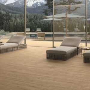 Elegant modern space featuring realistic oak-textured wood-look porcelain floor tiles in the light neutral Icon Pure finish from the Atlas Concorde Log Select collection.