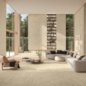 Elegant modern living room interior featuring large-format travertine-look porcelain floor tiles from the Atlas Concorde Marvel Travertine collection.